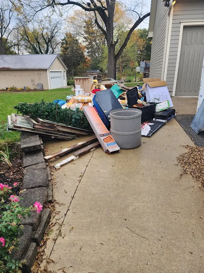 Dumpster being loaded with debris for 3 Yard Dumpster Rental in Burleson